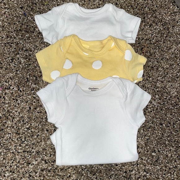 Gerber Other - SALE NWOT three baby onesies . Two white and one yellow with large white polka
